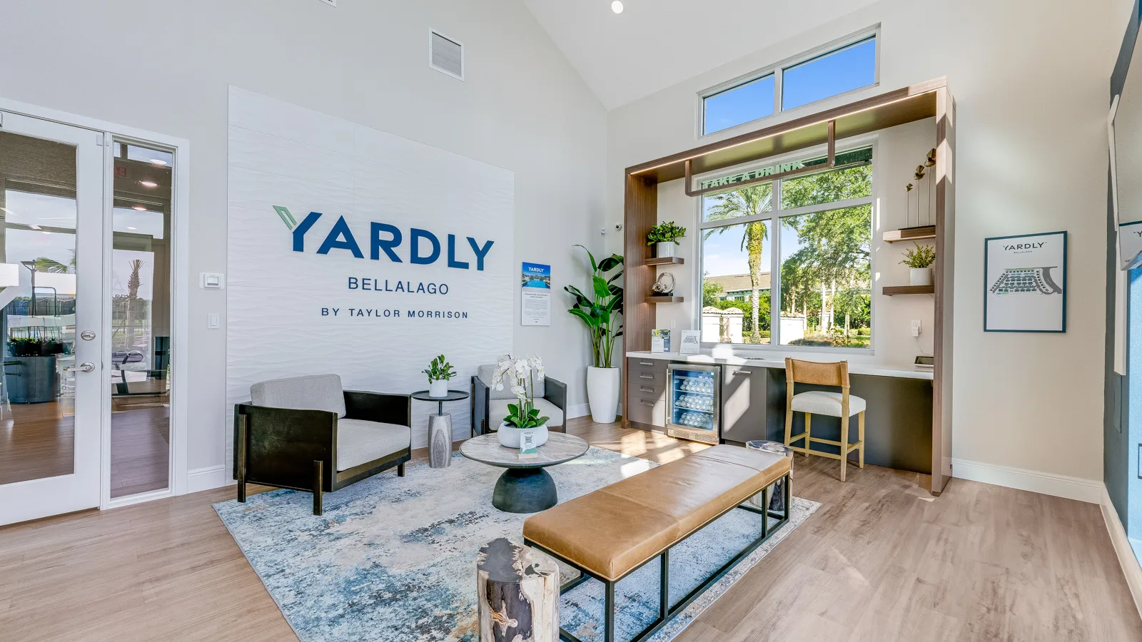 Leasing office and community space with seating and refreshments. New pet-friendly apartment homes for rent with private fenced backyards in Kissimmee, FL, near Orlando, FL with pickle ball, dog park, gym, and gated community. *No breed or weight restrictions. Yardly Bellalago